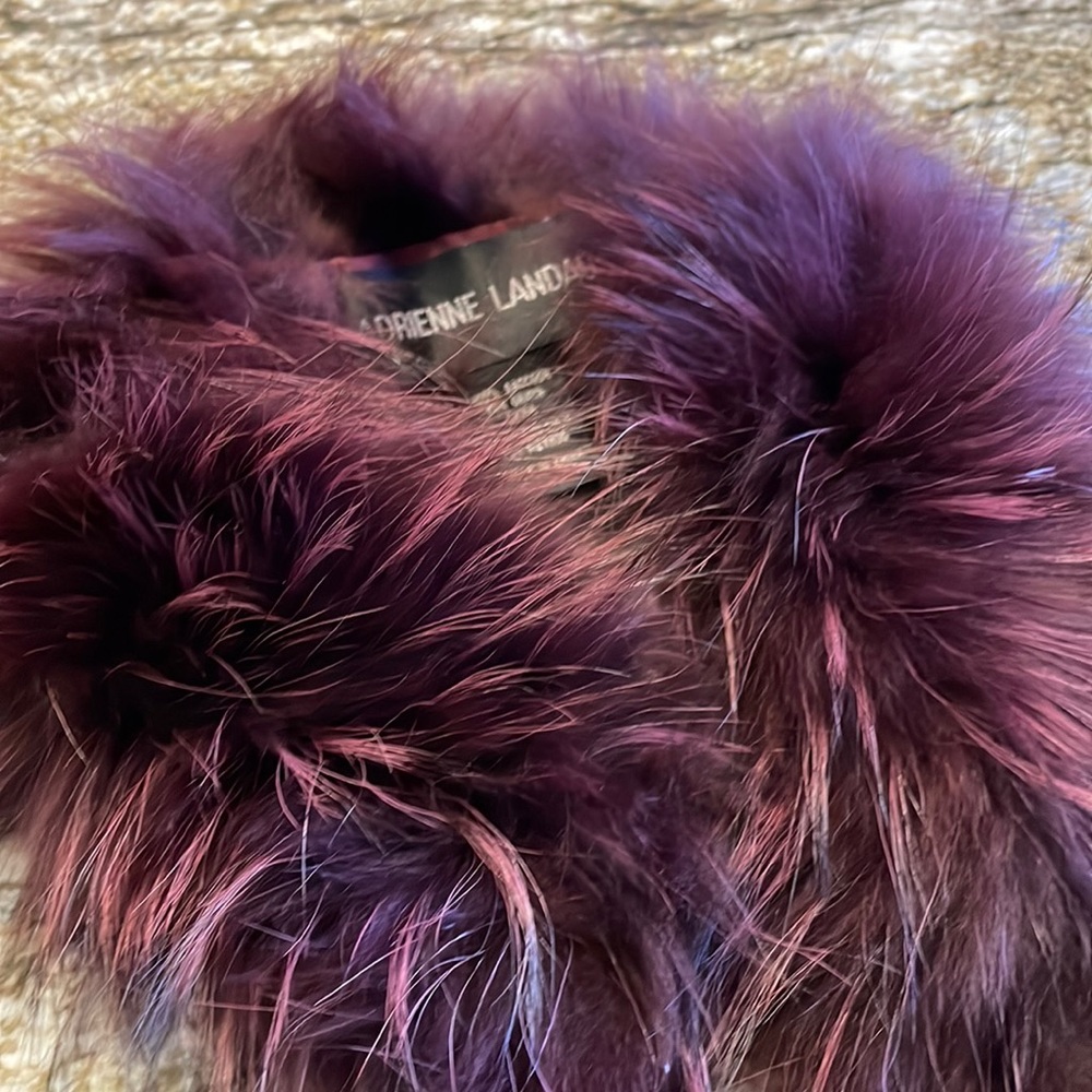 New condition, never worn Adrienne Landau raccoon fur neck wrap.